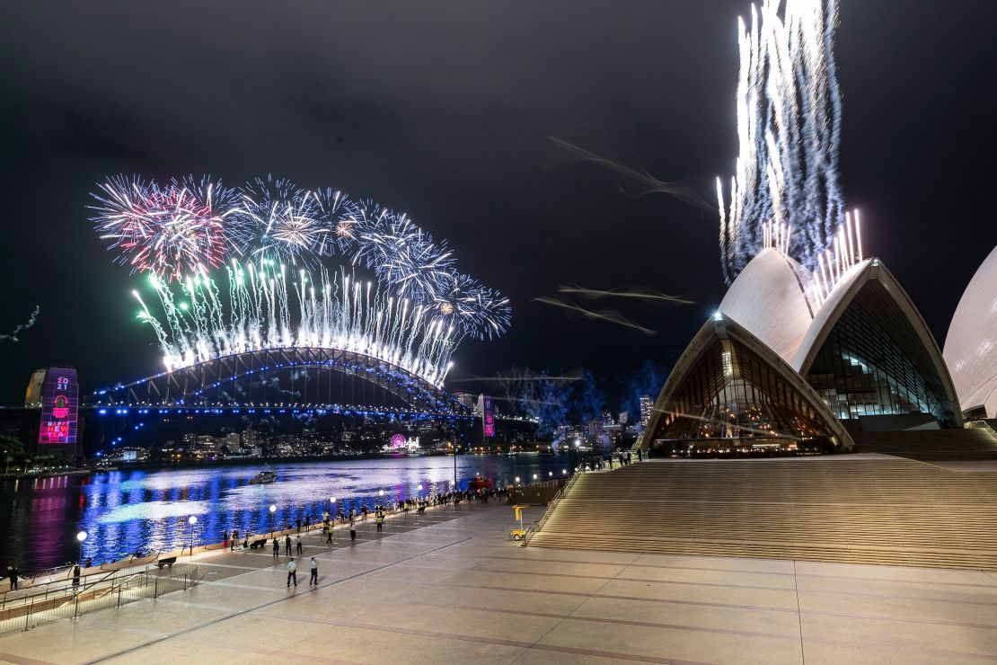 The Sydney Harbour fireworks display is seen over a near-empty Sydney Opera House.