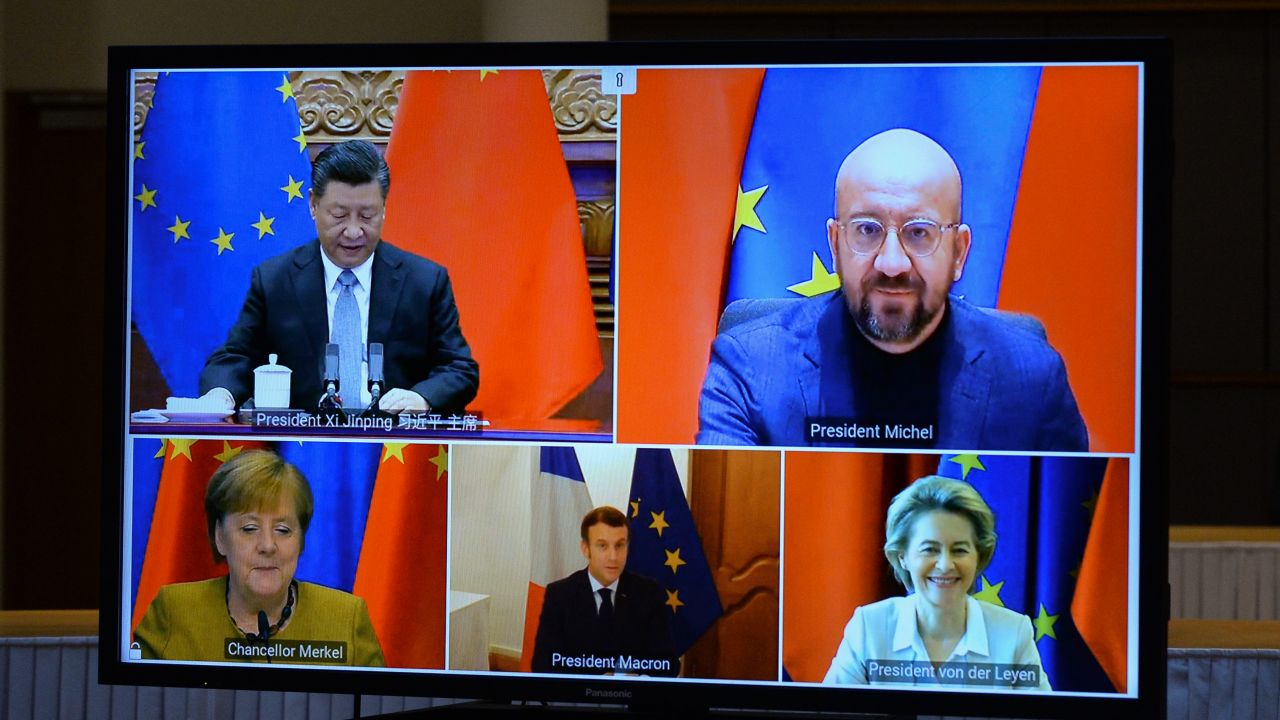 Chinese President Xi Jinping and European Union leaders seen on a screen during a video conference to approve an investment pact between China and the European Union on December 30, 2020 in Brussels, Belgium.