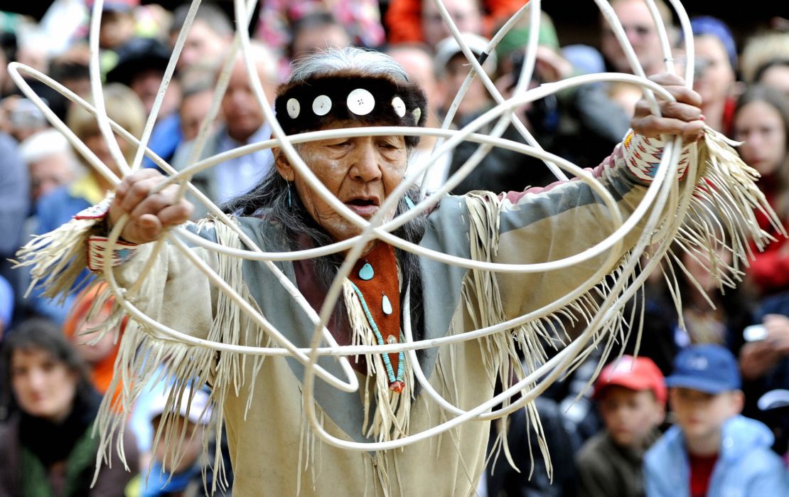 Navajo elder Jones Benally performs a traditional hoop dance at a festival in Germany in 2008.