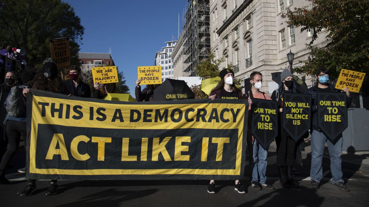 Protesters from the activist group Sunrise Movement march down H Street outside Lafayette Square in Washington, D.C. to express their objection to President Trump's response to the election results on November 5, 2020. (Photo by Matthew Rodier/Sipa USA)(Sipa via AP Images)