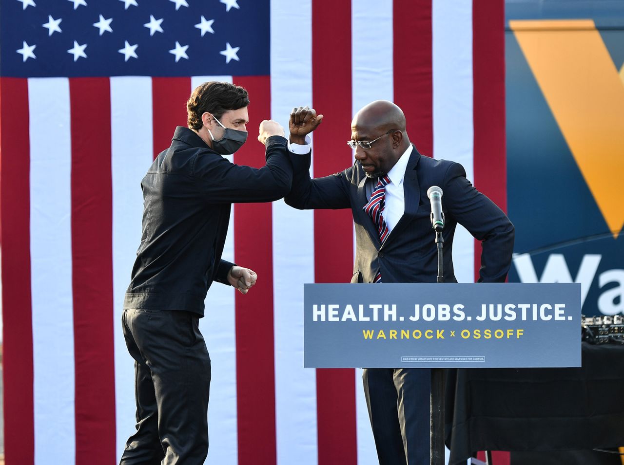 US Senate candidates Jon Ossoff, left, and Raphael Warnock greet each other on stage at a concert rally in Stonecrest, Georgia, on Monday, December 28. The two Democrats are competing against two Republicans in <a href="https://www.cnn.com/2020/11/05/politics/georgia-senate-jon-ossoff-david-perdue-kelly-loeffler-raphael-warnock/index.html" target="_blank">runoff elections</a> that will determine control of the Senate.