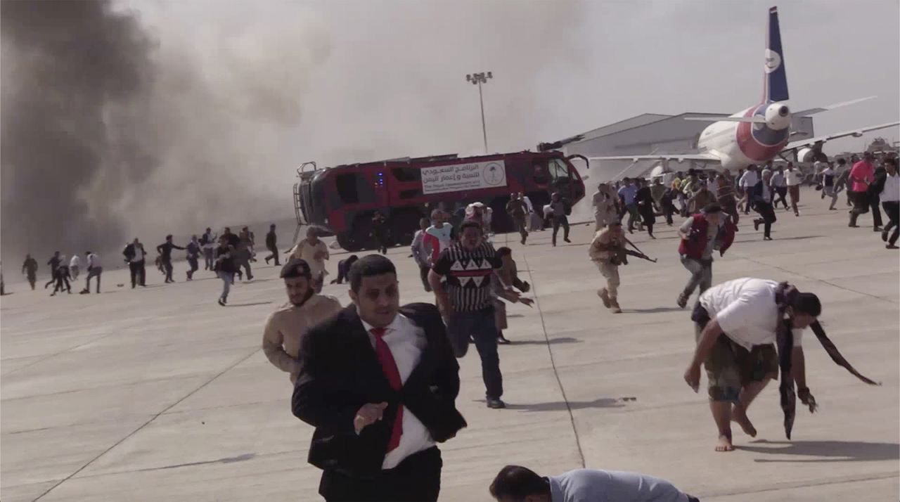 People run following an explosion at the airport in Aden, Yemen, on Wednesday, December 30. Several explosions hit the airport as the newly formed power-sharing government arrived from Saudi Arabia. <a href="https://www.cnn.com/2020/12/30/middleeast/yemen-explosion-government-intl/index.html" target="_blank">The blasts</a> killed at least 22 people and injured scores more, Rajeh Badi, the spokesman for the new government, told CNN. All the Cabinet members were safe, according to Yemen Prime Minister Maeen Abdulmalek.