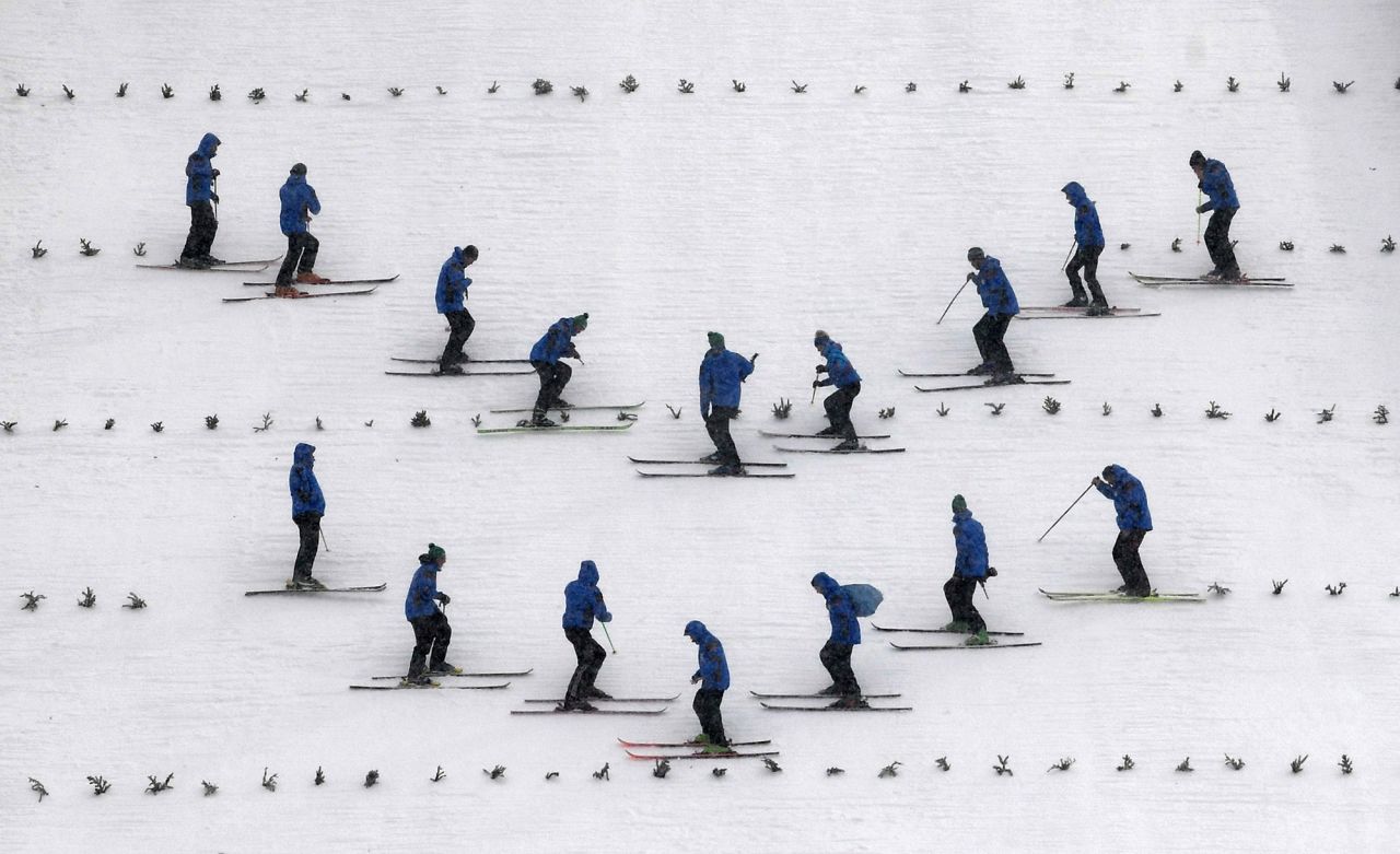 Workers prepare a hill for training jumps at the Four Hills ski-jumping tournament in Oberstdorf, Germany, on Monday, December 28. <a href="http://www.cnn.com/2020/12/24/world/gallery/photos-this-week-december-17-december-24/index.html" target="_blank">See last week in 21 photos</a>