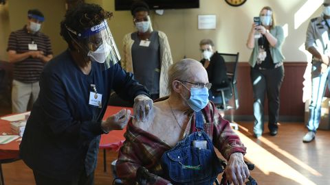 A nurse administers the Covid-19 vaccine to Korean War veteran Melvin Menard, 88, in Aurora, Colorado, on December 22.