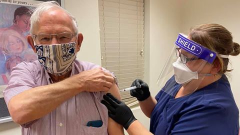 Angie Gray vaccinates former Berkeley County commission president "Admiral" Bill Stubblefield.