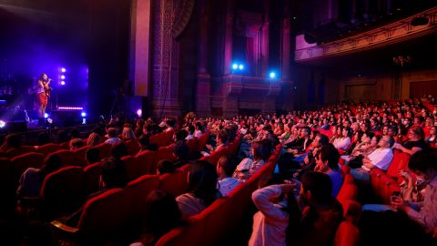By late 2021, Americans hope to see some normalcy return to their lives. Here, people attend a performance at the Civic Theatre on November 27, 2020 in Auckland, New Zealand. 