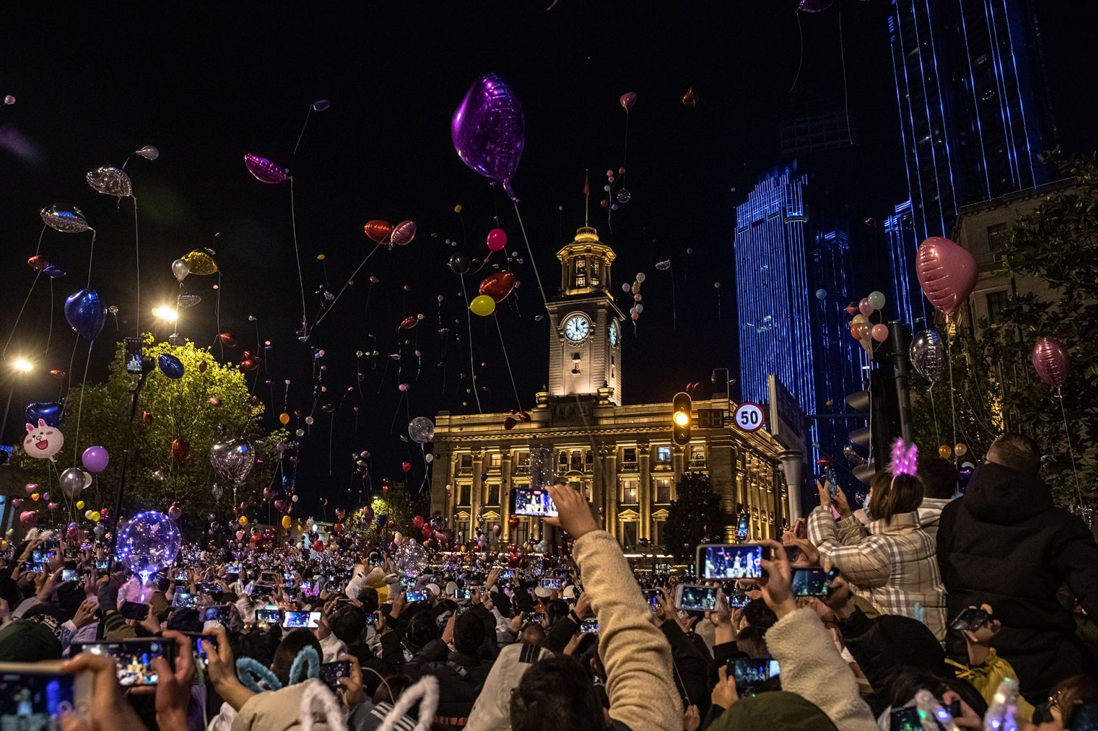 People celebrate the new year in Wuhan, China, which nearly a year ago became the epicenter of the coronavirus outbreak.