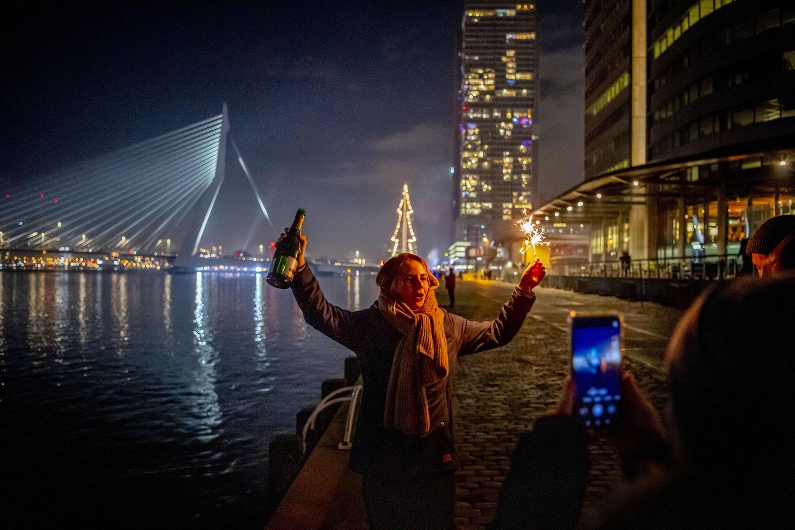 Revelers celebrate on the Erasmus Bridge in Rotterdam, the Netherlands' second-largest city.