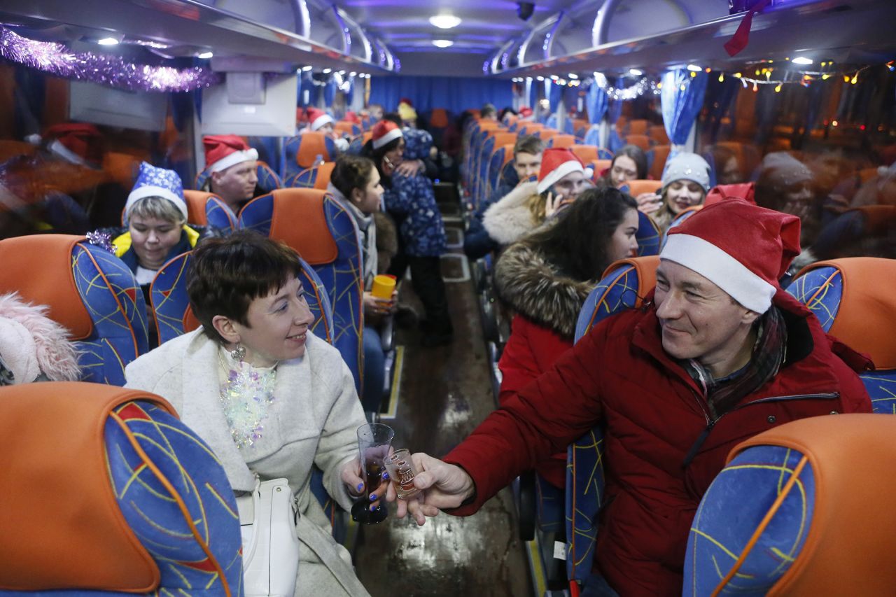 Passengers celebrate inside a party bus driving through Moscow.