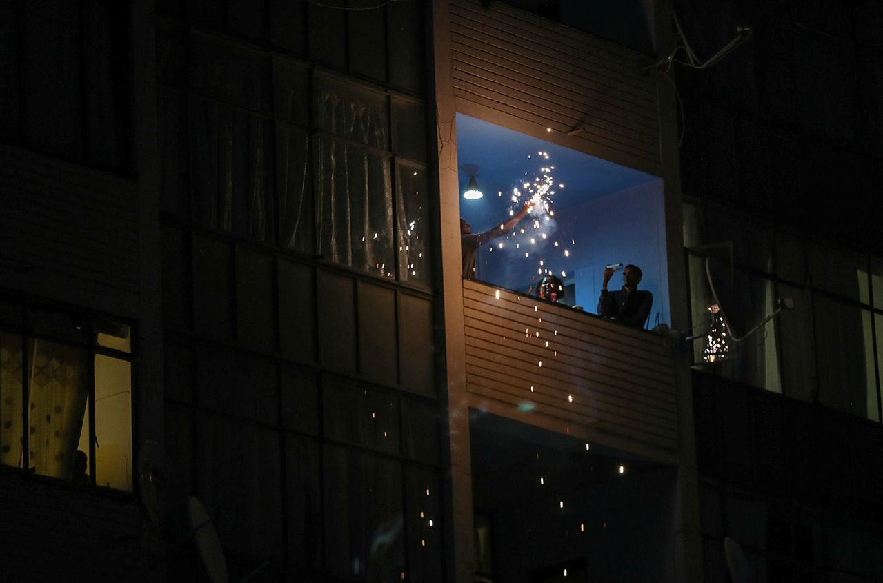 Revelers celebrate on a balcony in Johannesburg.