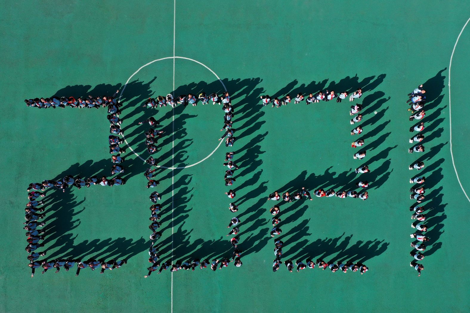 This aerial photo shows students in Xiangyang, China, standing in formation to mark 2021.