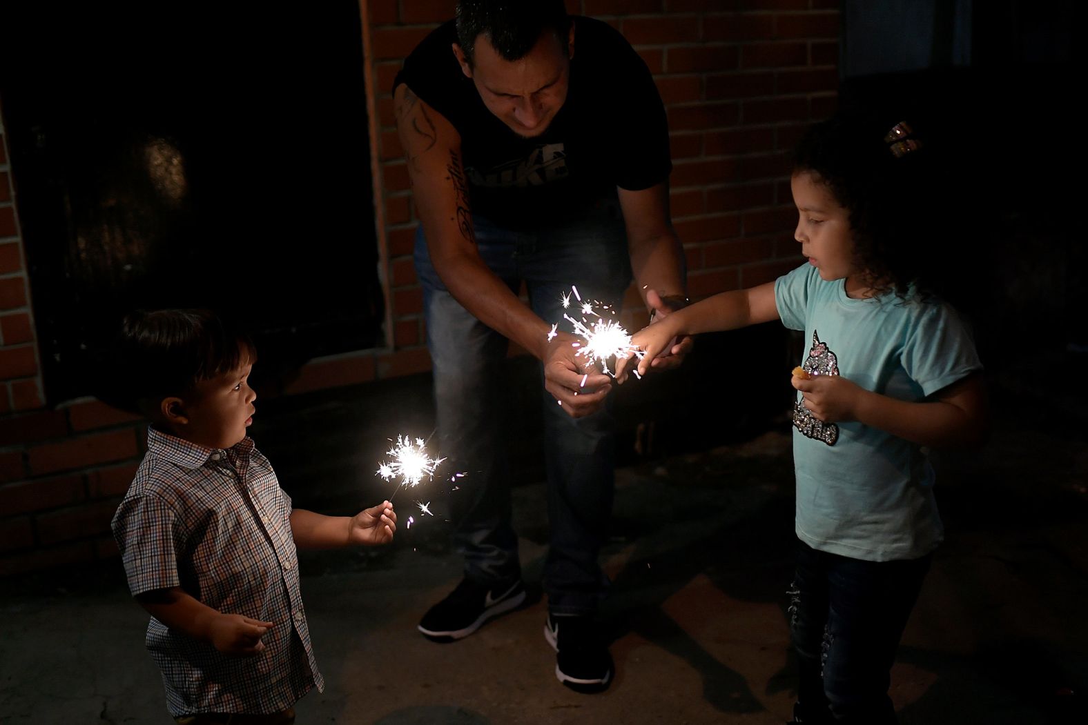 Children play with sparklers in Caracas, Venezuela.