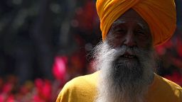 British Indian marathon runner Fauja Singh, aged 101, poses at a park in Hong Kong February 21, 2013.