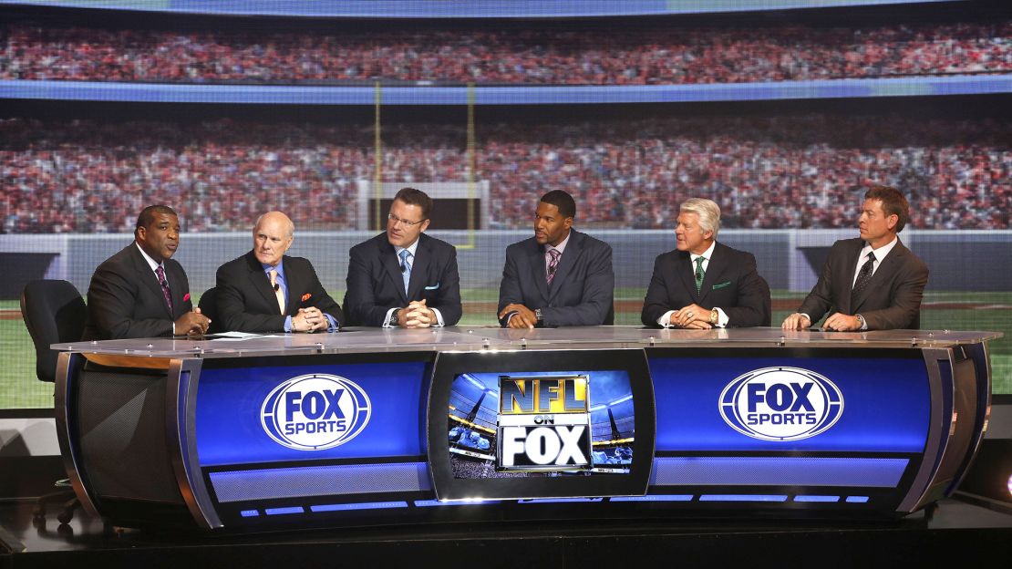 Members of the Fox NFL Sunday broadcast team, including Johnson, are seen in March 2013.