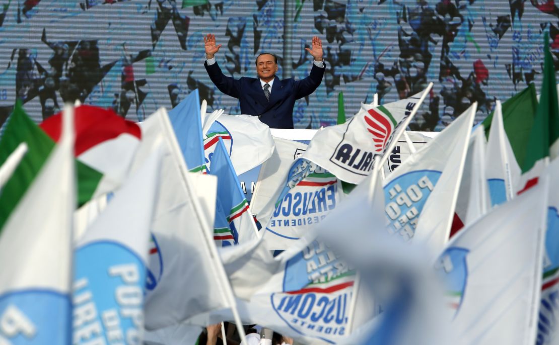 Italy's former Prime Minister Silvio Berlusconi waves in March 2013 during a protest of his People of Freedom (PDL) party against what he called "judicial persecution" by politically motivated magistrates.