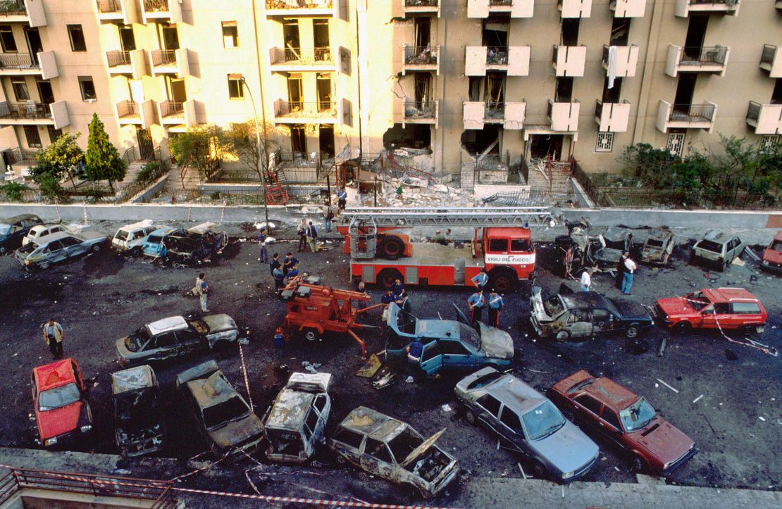 Burned cars are seen the day after a bomb attack that killed judge Paolo Borsellino and his police guards in Palermo July 20, 1992.