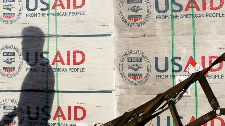 The shadow of a Philippine Army personnel is cast on boxes of relief items from U.S. Agency for International Development (USAID) for the victims of super typhoon Haiyan, at Villamor Air Base in Manila November 13, 2013.