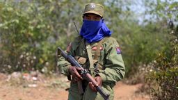 A rebel soldier of the Myanmar National Democratic Alliance Army (MNDAA) holds his rifle as he guards near a military base in Kokang region March 11, 2015.