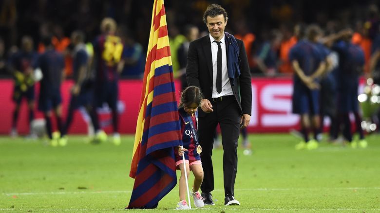 Football - FC Barcelona v Juventus - UEFA Champions League Final - Olympiastadion, Berlin, Germany - 6/6/15 
Barcelona coach Luis Enrique celebrates with his daughter after winning the UEFA Champions League 
Reuters / Dylan Martinez