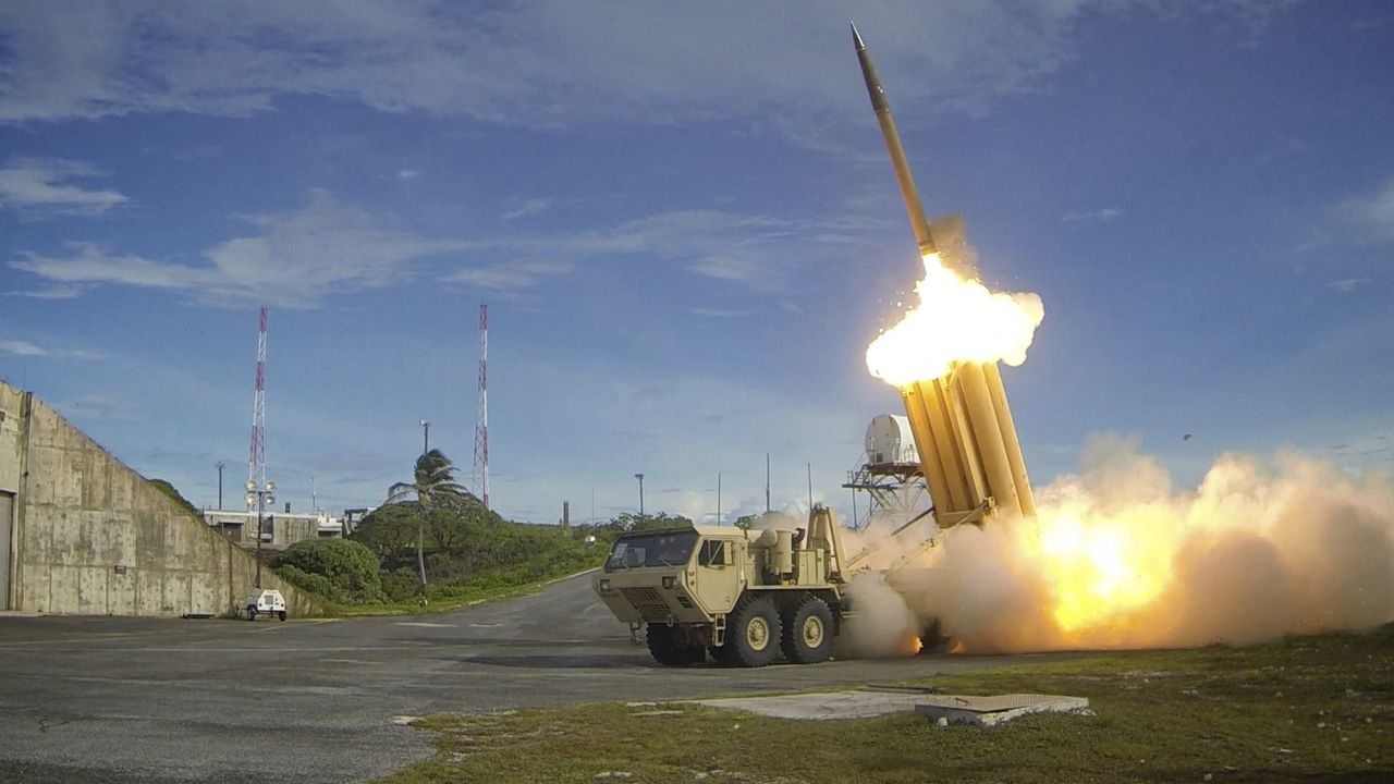 A Terminal High Altitude Area Defense (THAAD) interceptor is launched during a successful intercept test, in this undated handout photo.