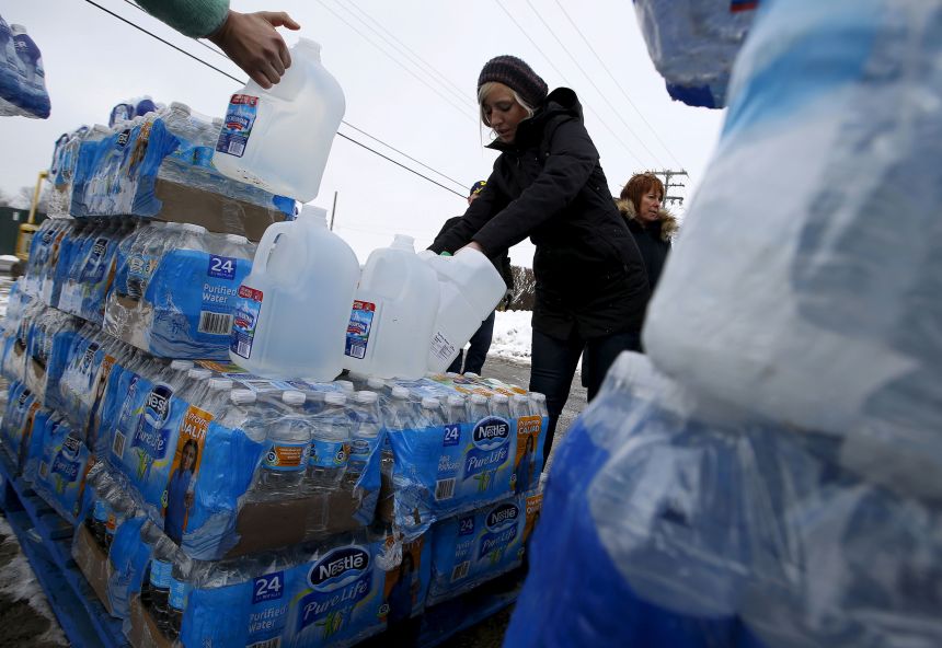 Volunteers distribute bottled water in Flint, Michigan, on March 5, 2016.