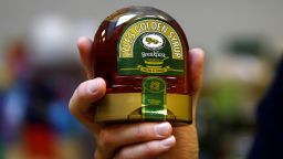 Tate & Lyle senior vice-president of sugars, Gerald Mason, holds a jar of golden syrup at the company's refinery in east London, Britain October 10, 2016.