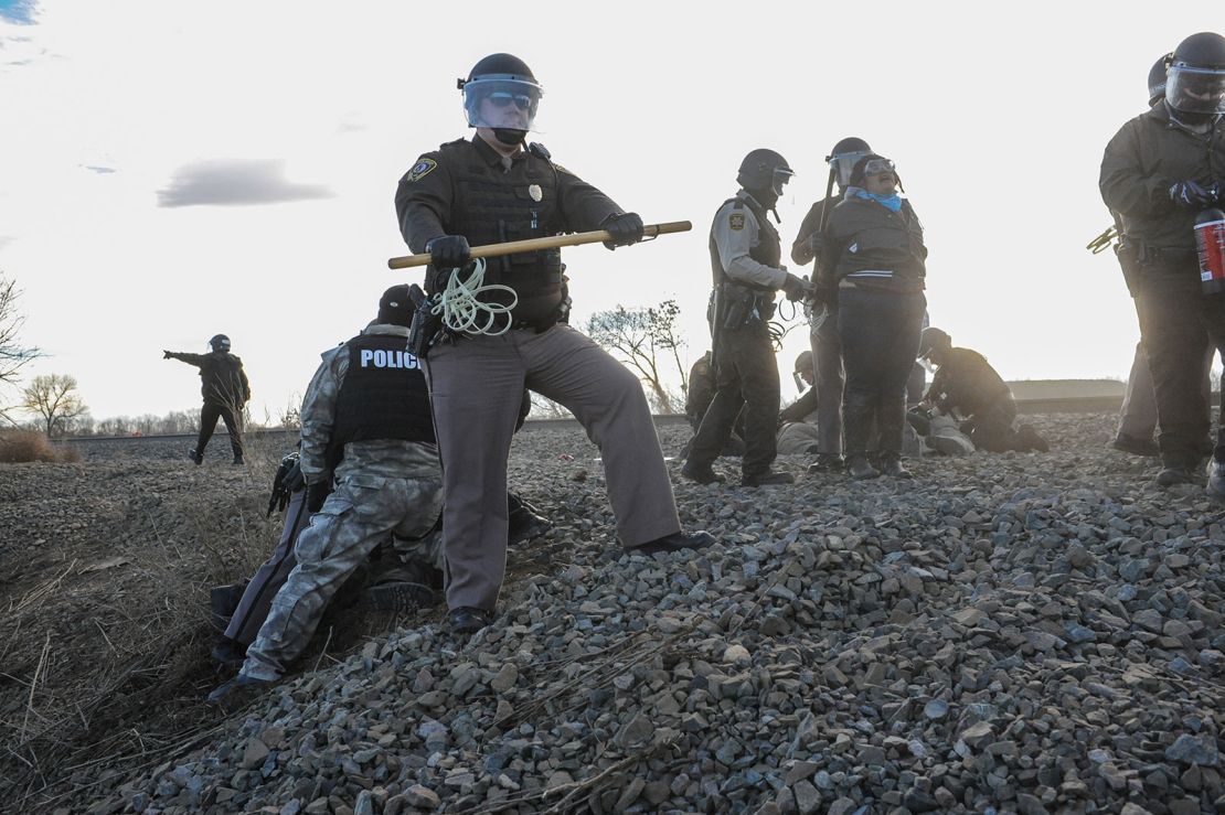 Police arrest protesters demonstrating against the Dakota Access Pipeline near the Standing Rock Indian Reservation in Mandan, North Dakota, in November 2016. Since the Dakota Access pipeline protests, multiple US states have cracked down on protests near oil and gas pipelines.