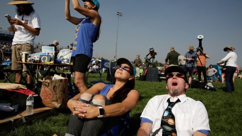 People watch the solar eclipse during the Lowell Observatory Solar Eclipse Experience at Madras High School in Madras, Oregon, U.S. August 21, 2017. Location coordinates for this image are 44Â°37â50â N  121Â°7â15â W. REUTERS/Jason Redmond