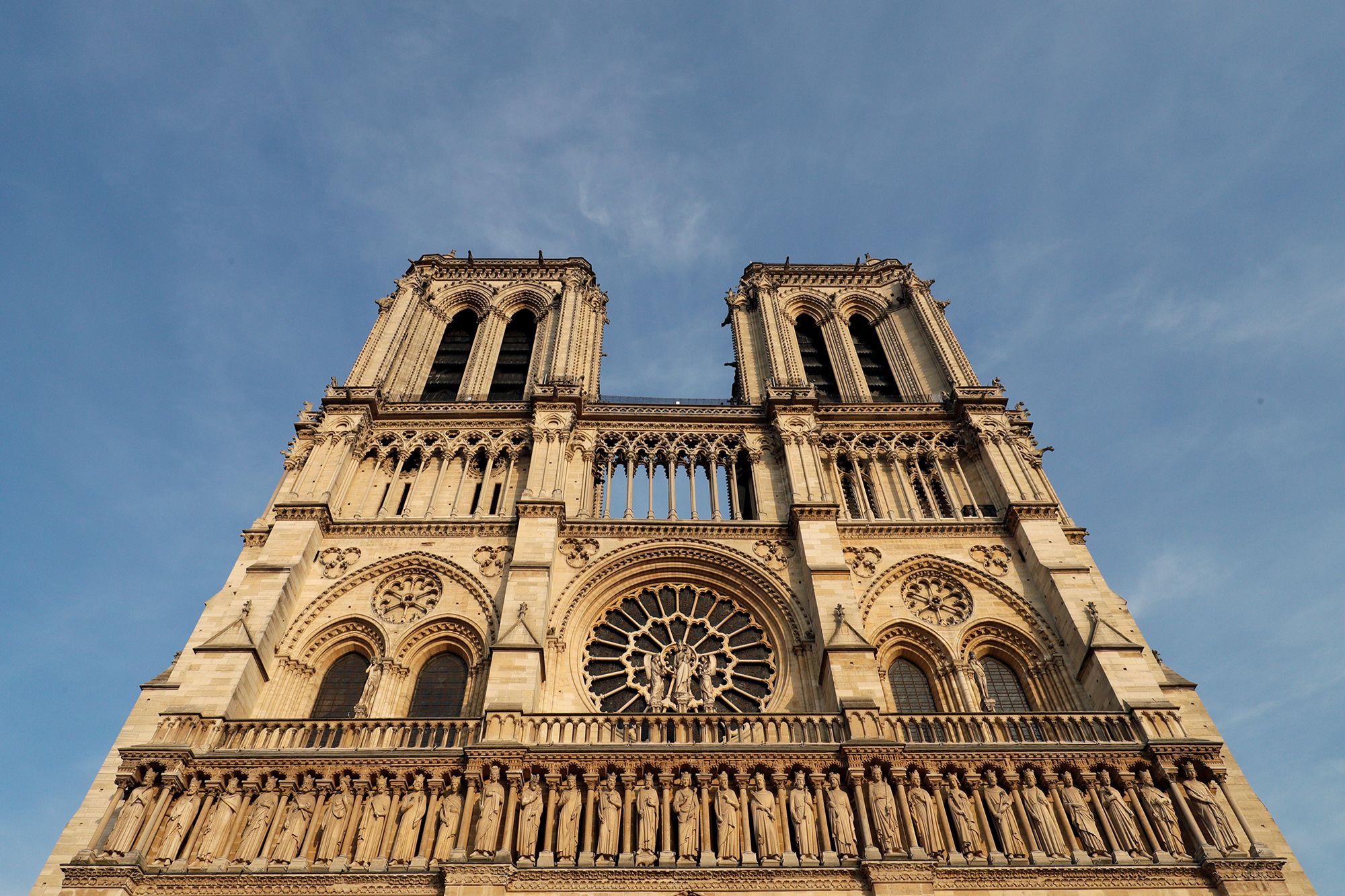 Notre Dame Cathedral pictured in 2017, two years before a fire ravaged the building. The gothic church is now set to reopen in early December following an extensive restoration.