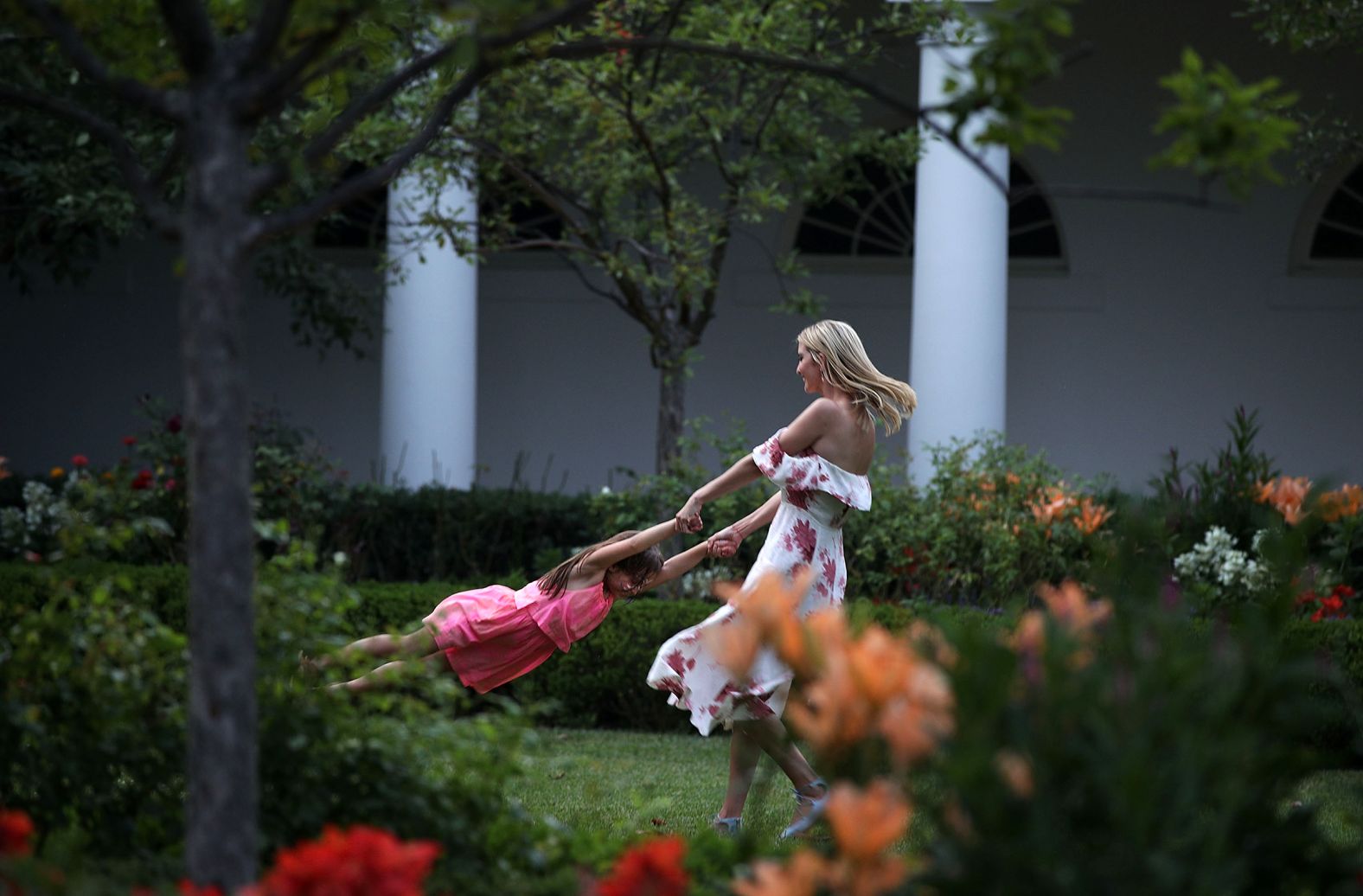 Ivanka Trump plays with her daughter Arabella Rose Kushner in the Rose Garden in June 2017.