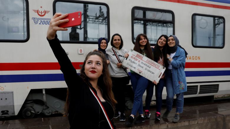 Sibel Uysal, 20, poses for a selfie with her friends before the Eastern Express departs from Ankara province en route from Ankara to Kars, Turkey, April 9, 2018. REUTERS/Umit Bektas  SEARCH "BEKTAS EXPRESS" FOR THIS STORY. SEARCH "WIDER IMAGE" FOR ALL STORIES.