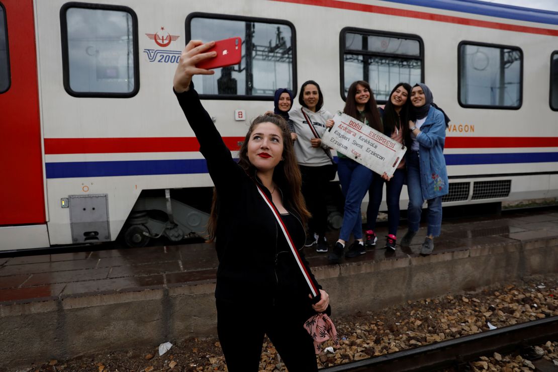 A traveler poses for a selfie with her friends before the Eastern Express departs Ankara.