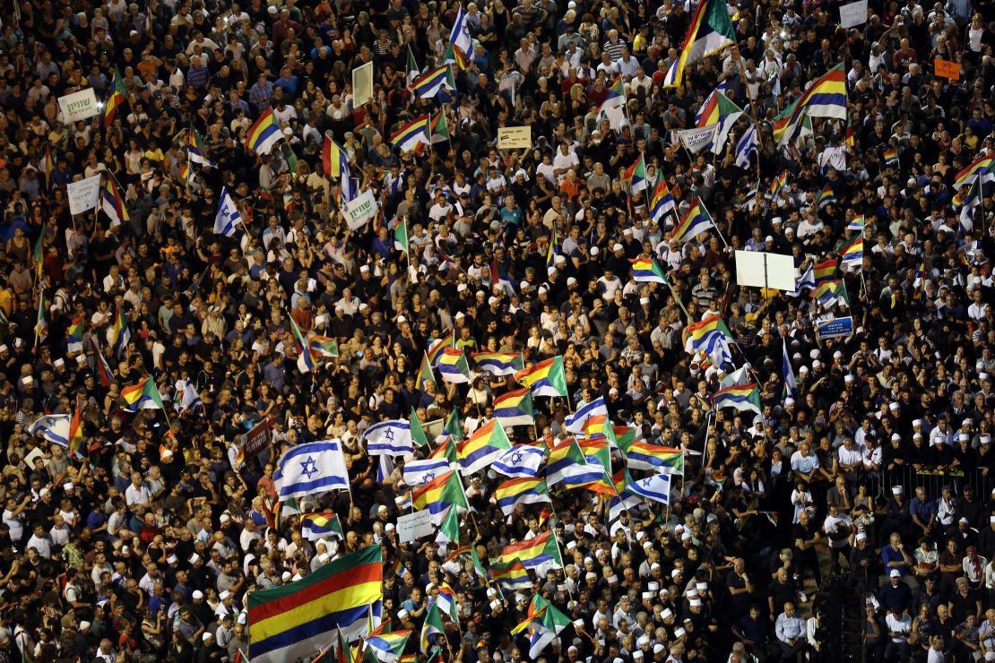 Israelis from the Druze minority, together with others, held Israeli and Druze flags in a rally to protest against the nation-state law in Tel Aviv, Israel, in 2018.