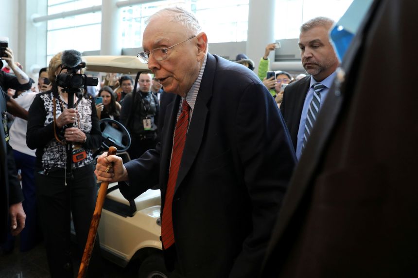 Charlie Munger Sr. walks past a crowd at the annual Berkshire shareholder shopping day in Omaha, Nebraska, on May 3, 2019.