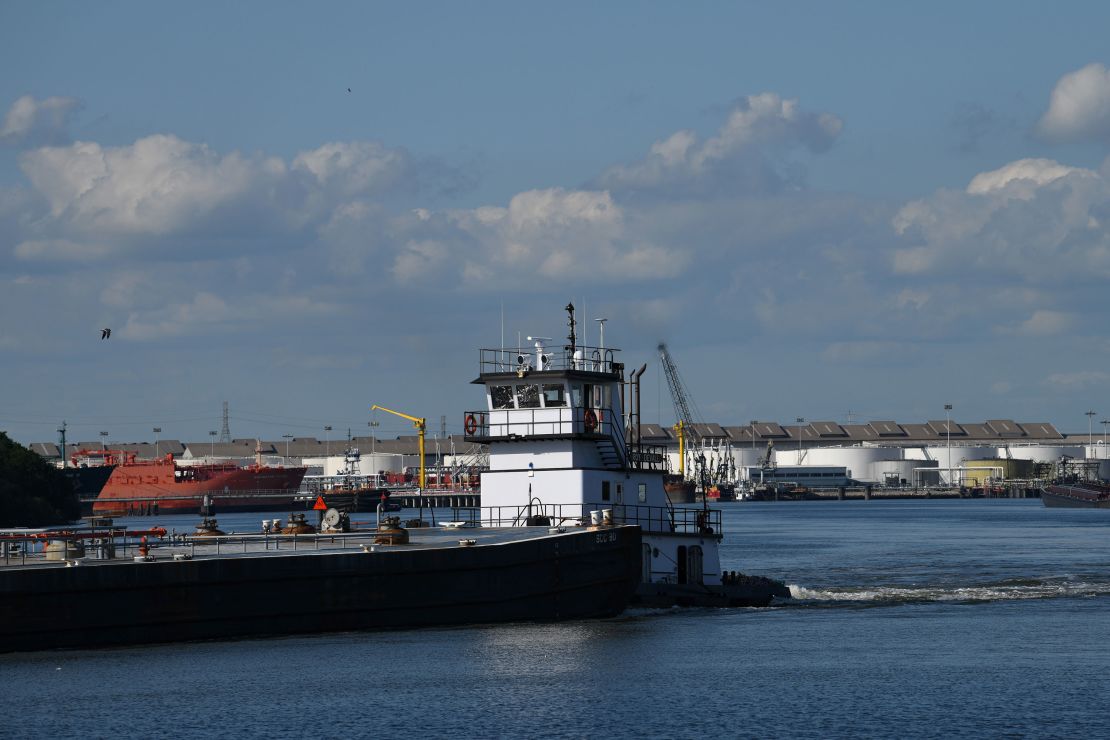 A barge travels through the Houston Ship Channel, part of the Port of Houston, in Pasadena, Texas, May 5, 2019.