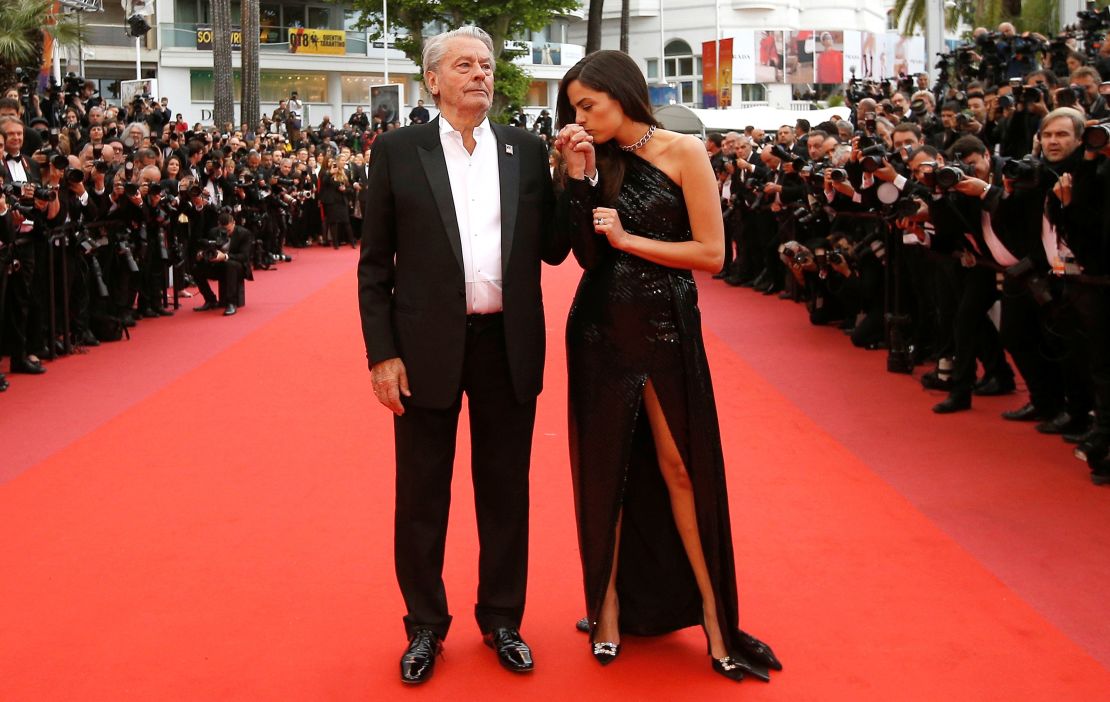 Delon poses with his daughter Anouchka on the red carpet of the 72nd Cannes Film Festival before receiving his honorary Palme d'Or Award in May 2019.