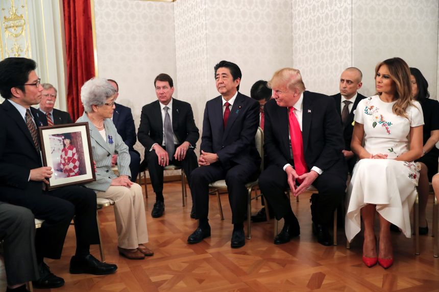 US President Donald Trump, first lady Melania Trump and Japan's Prime Minister Shinzo Abe meet with family members of people abducted by North Korea, at Akasaka Palace in Tokyo on May 27, 2019.