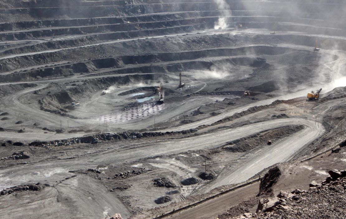 Miners are seen at the Bayan Obo mine containing rare earth minerals, in China's Inner Mongolia in 2011.