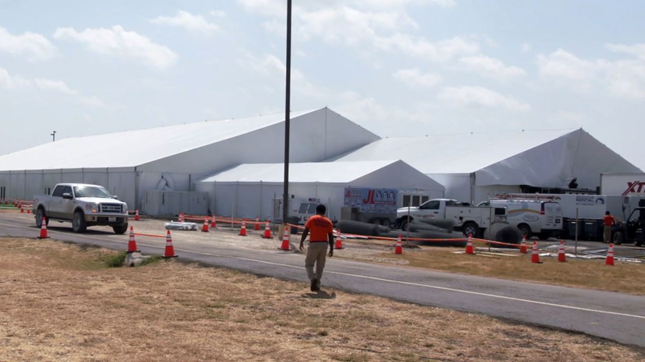 Covered structures are seen at the US Department of Health and Human Services' unaccompanied minors migrant detention facility at Carrizo Springs, Texas, on July 5, 2019.