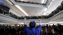 A group of musicians play "Glory to Hong Kong," a protest song, during a flash mob protest inside a shopping mall at Kowloon Tong, in Hong Kong, China, on September 18, 2019.