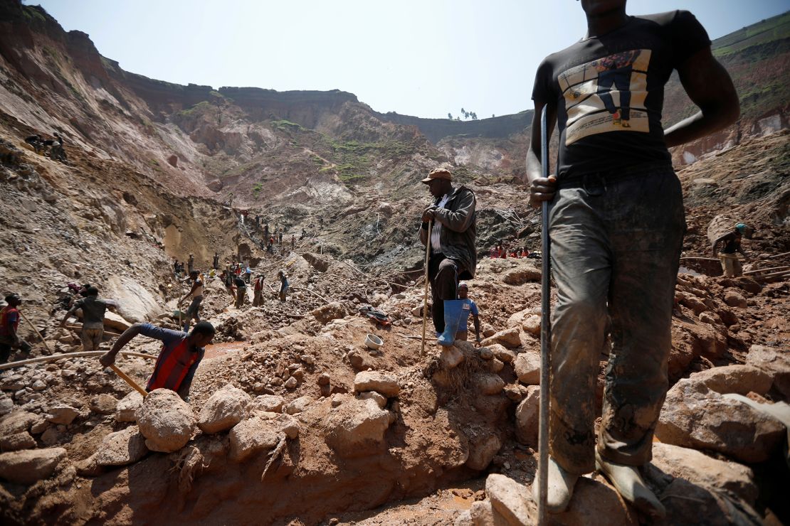 Laborers work at an open shaft of the SMB coltan mine near the town of Rubaya in eastern DRC, on August 13, 2019.