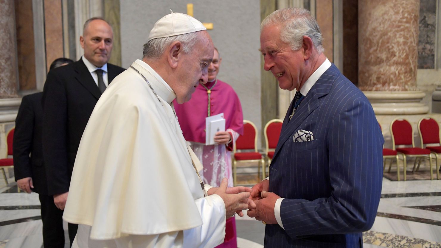 Pope Francis speaks with then-Prince Charles at the Vatican on October 13, 2019. 