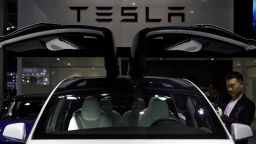 In this November 2019 photo, a Tesla sign is seen at the China International Import Expo in Shanghai, China. Tesla recently broke ground on a Megapack battery factory in Shanghai, as a part of its expansion plan in China.