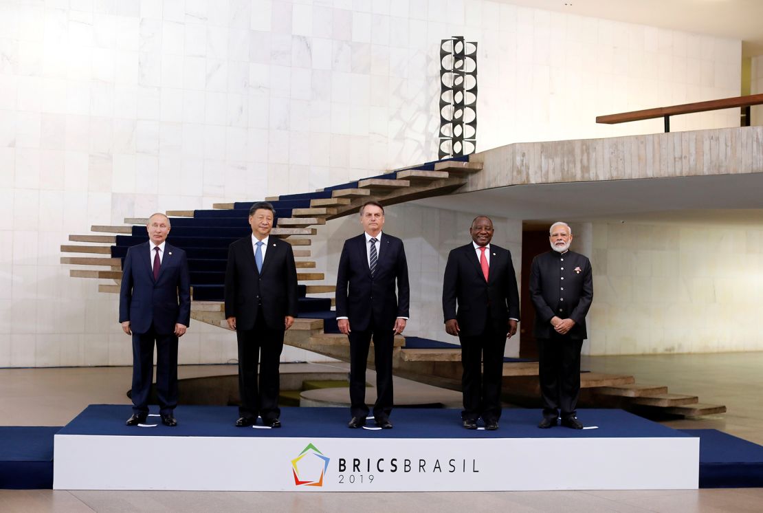 Russian President Vladimir Putin, Chinese leader Xi Jinping, then-Brazilian President Jair Bolsonaro, South African President Cyril Ramaphosa and Indian Prime Minister Narendra Modi pose as they arrive for the BRICS summit in Brasilia in November 2019.