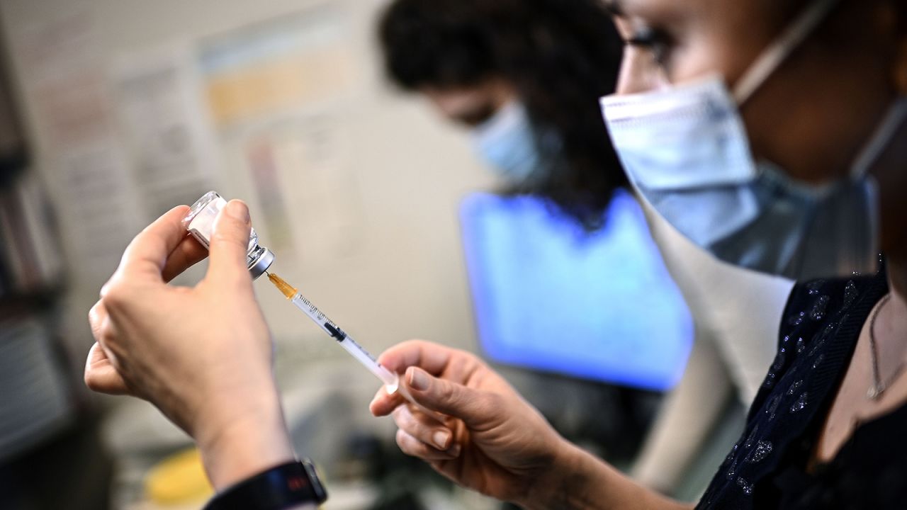 Doctor Marie Msika Razon prepares doses of the AstraZeneca Covid-19 vaccine before vaccinating patients aged over 50 and suffering from a comorbidity, at her medical office in Paris, on February 25.