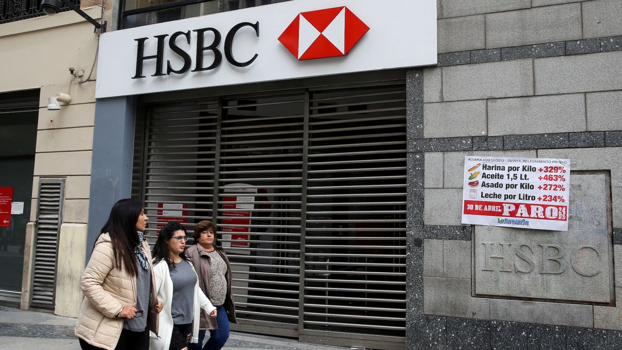 Pedestrians walk past closed HSBC bank during a national strike in Buenos Aires, Argentina.