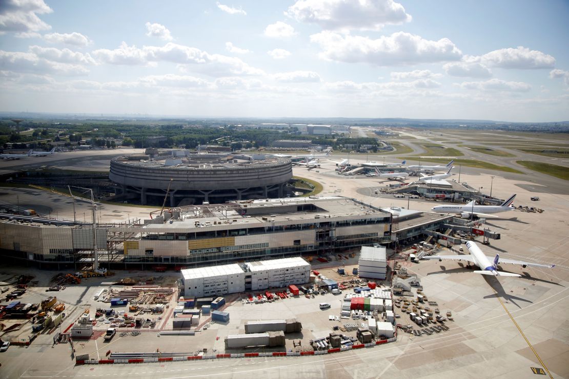 The passenger has been detained at Charles de Gaulle Airport for several days.