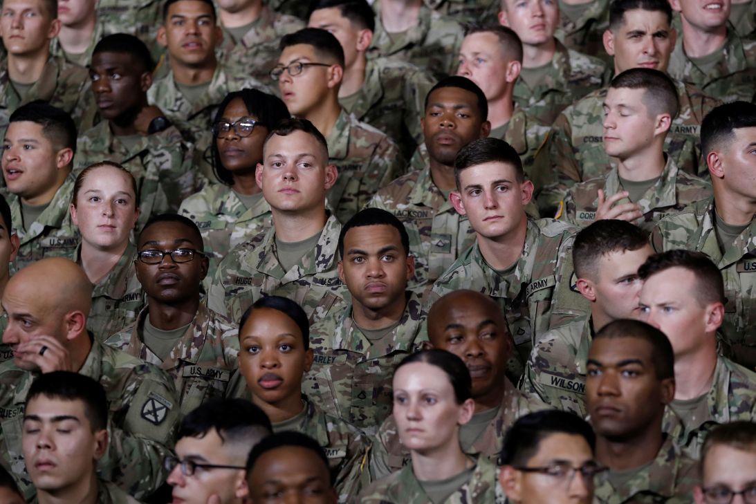 US Army 10th Mountain Division troops listen as President Donald Trump speaks at Fort Drum, New York, on August 13, 2018.