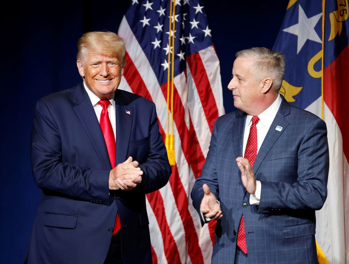 Former President Donald Trump is introduced by North Carolina Republican Party chairman Michael Whatley before speaking at the state GOP convention dinner in Greenville, North Carolina, in June 2021.