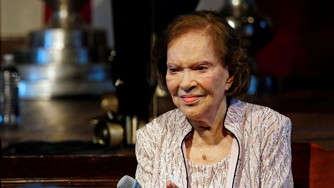 Former first lady Rosalynn Carter sits a reception to celebrate her and former President Jimmy Carter's 75th wedding anniversary in Plains, Georgia, in July 2021.